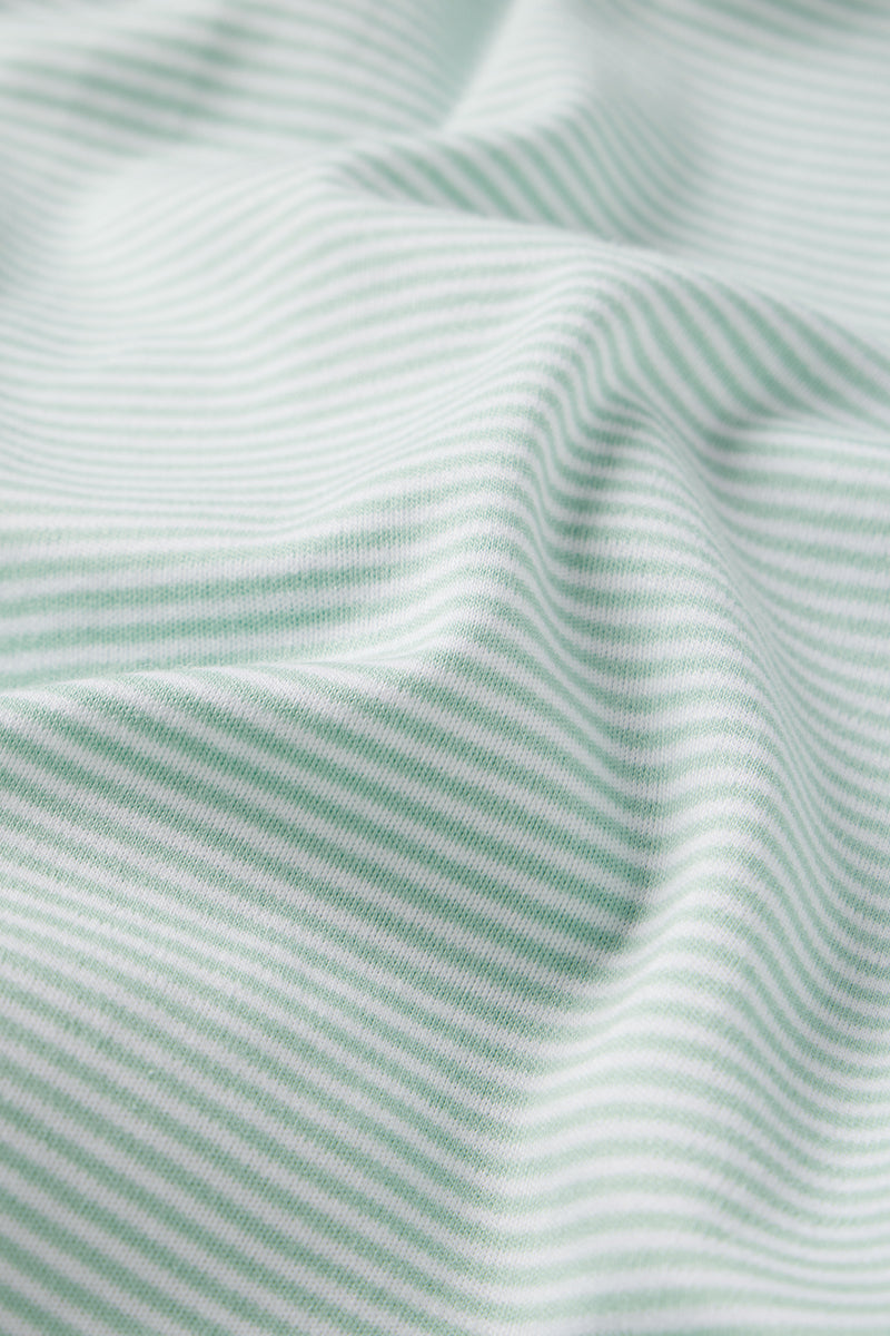 Close-up of the Pima Long Sleeve Nightgown in Parisian Green, featuring green and white stripes on smooth, lightweight Pima cotton with soft, wavy folds that create gentle shadows and consistent texture.