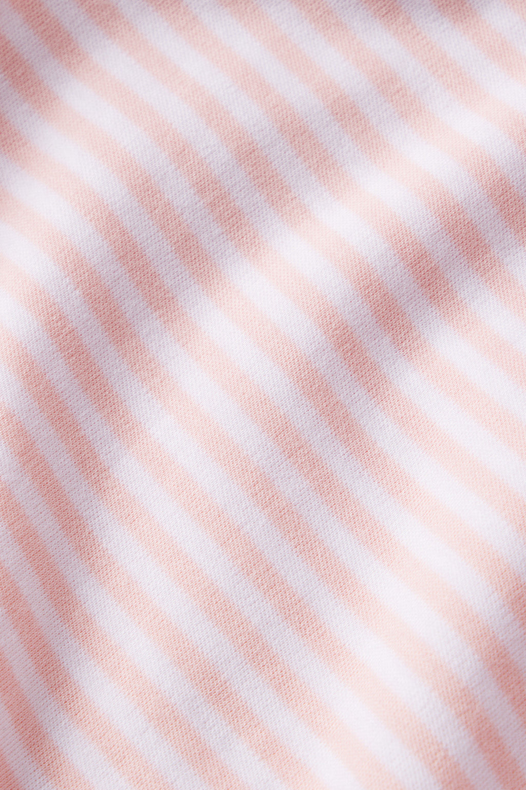 Soft, close-up view of the Pima Maternity Nightgown in English Rose Stripe, featuring gentle light pink and white stripes with a subtle texture and folds. Made from soft Pima Cotton—ideal comfort for maternity wear.