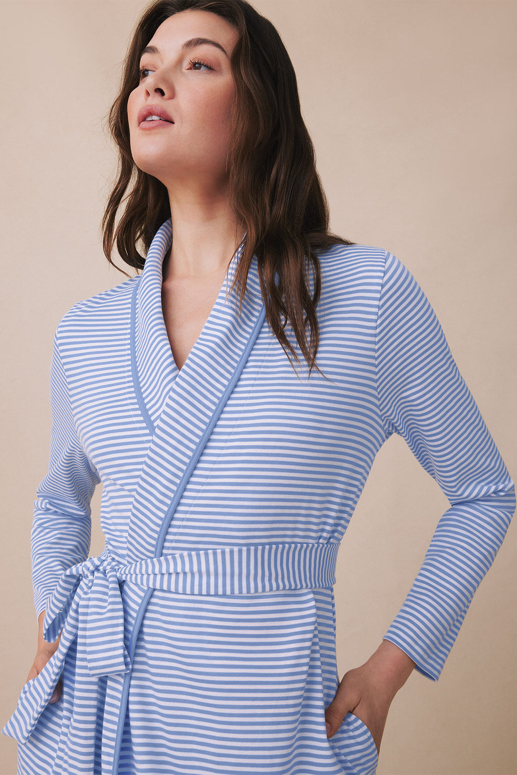 Blue and white striped robe with long sleeves, wrap front, and tie belt at waist.