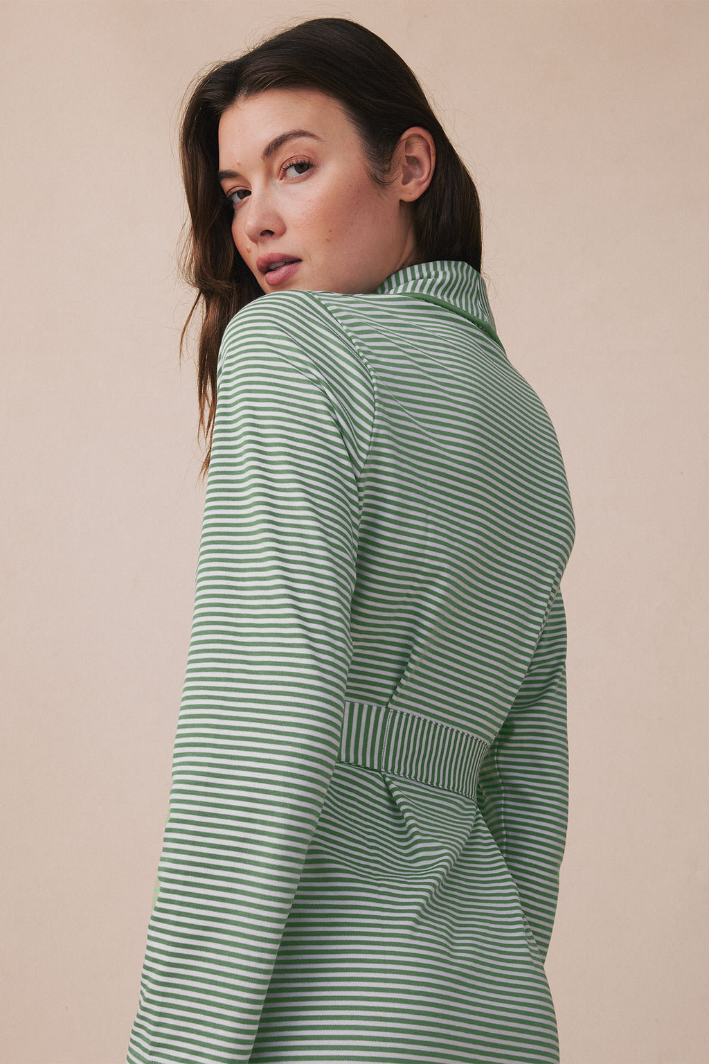 Green and white striped Pima robe with long sleeves and patch pockets, worn by model shown from behind.