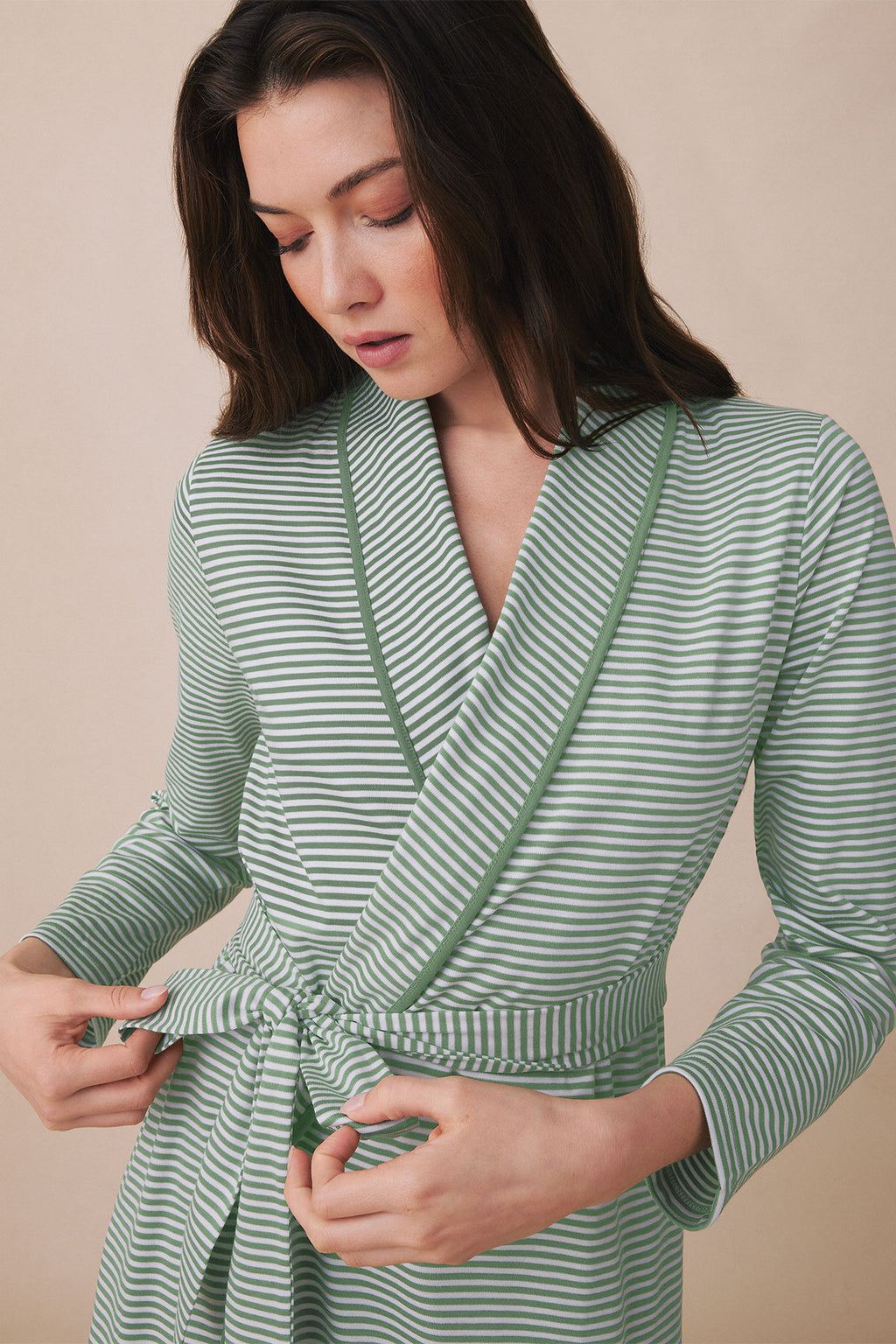Green and white striped wrap robe with long sleeves and tie waist closure.