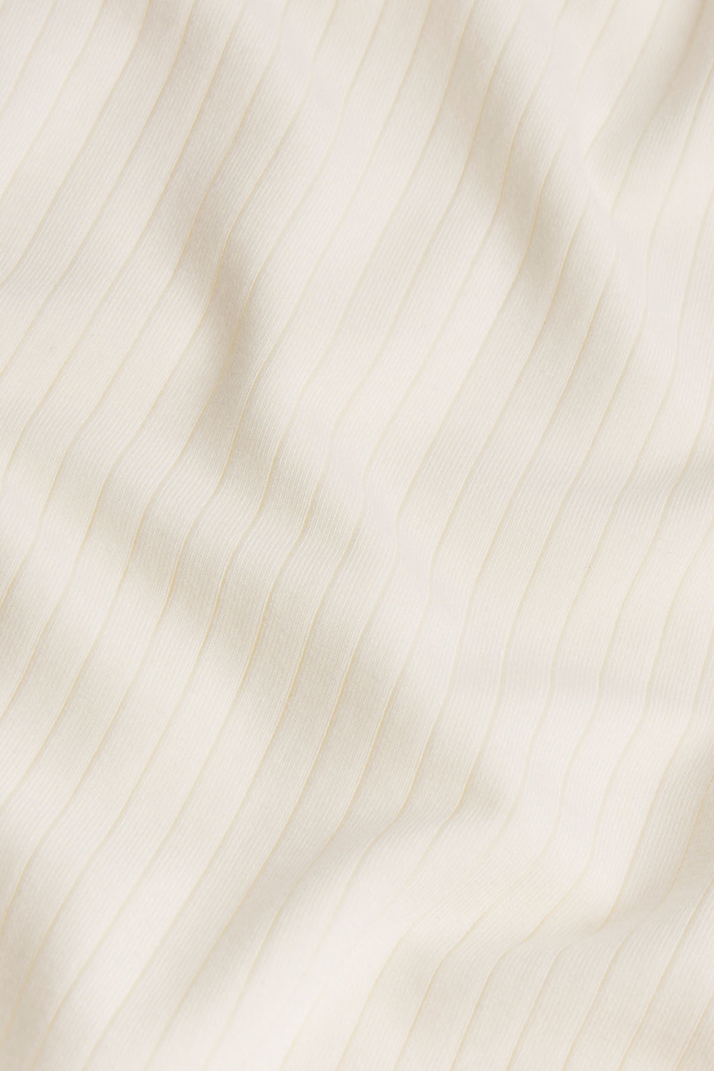 Ivory fabric with vertical pinstripe texture detail.