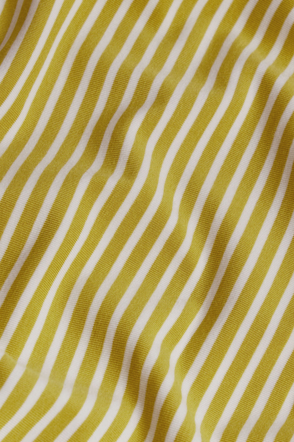 Chartreuse and cream vertical pencil stripe velvet fabric with textured waffle weave surface.