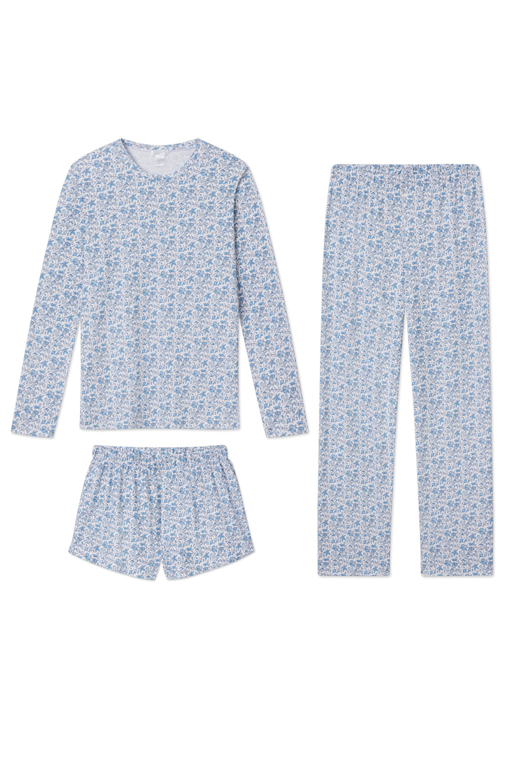 The Pima Crew Long Sleeve Bundle in Delft Blue Garden Floral includes a long sleeve top, long pants, and shorts—each made from 100% Pima cotton and displayed on a white background.