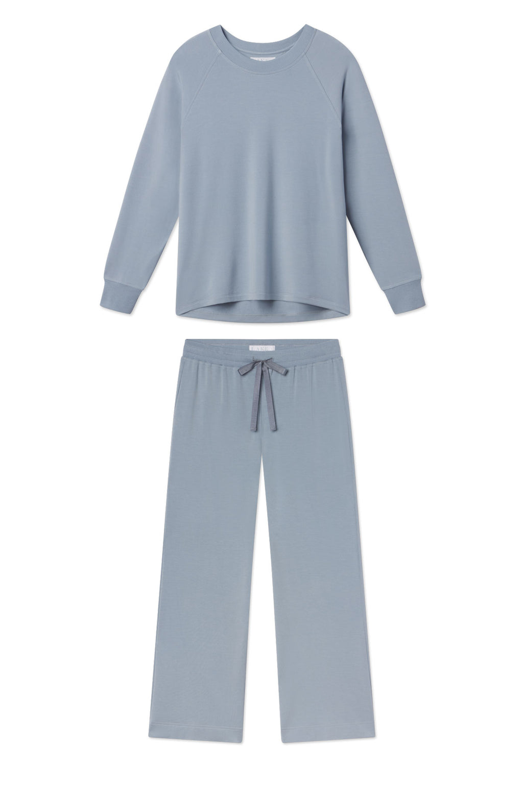 The Relax Pants Set in Dusty Blue, featuring a long-sleeve crewneck top and wide-leg pants with an adjustable drawstring waistband, is shown laid flat on a white background.