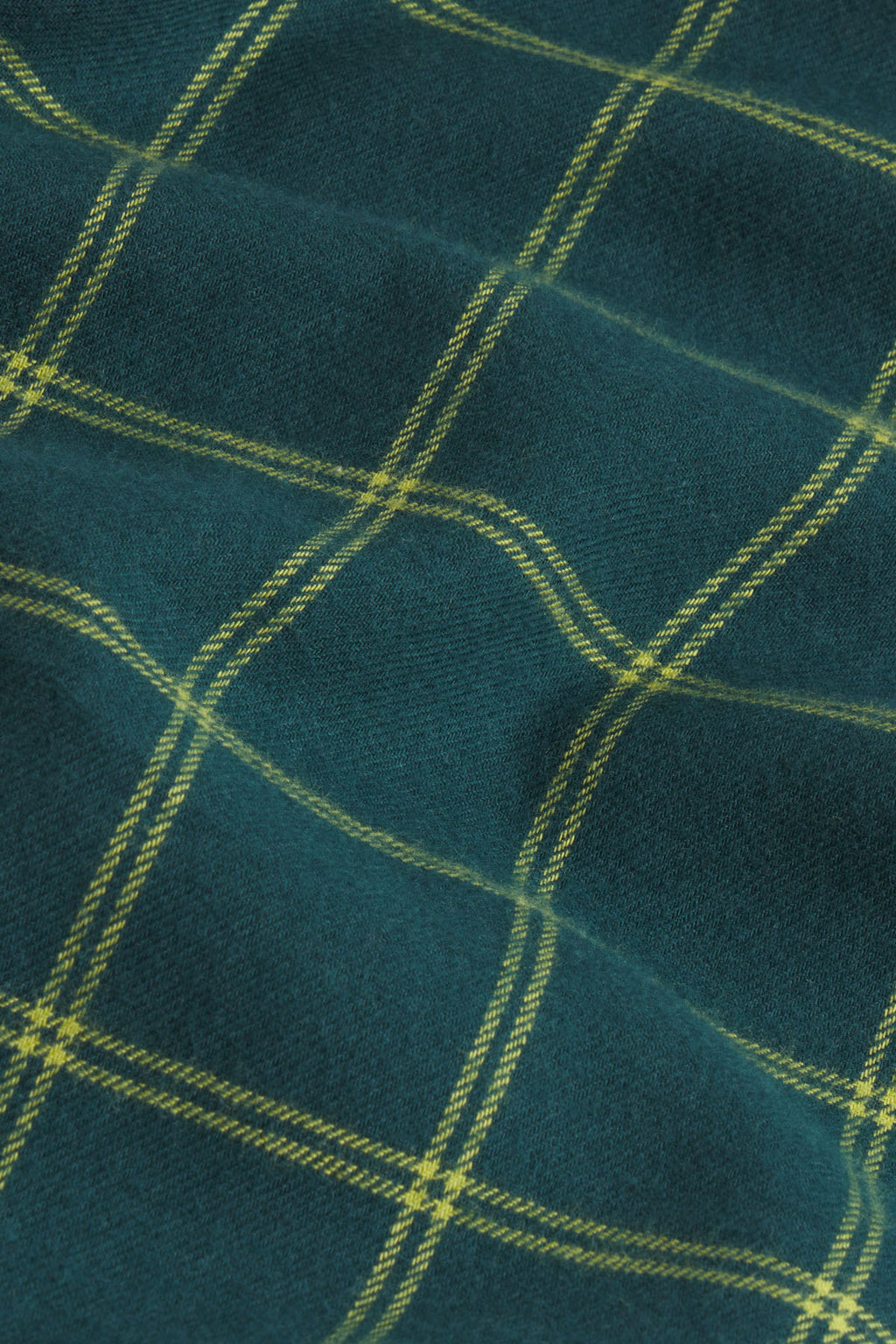 Dark teal flannel fabric with yellow windowpane plaid pattern.