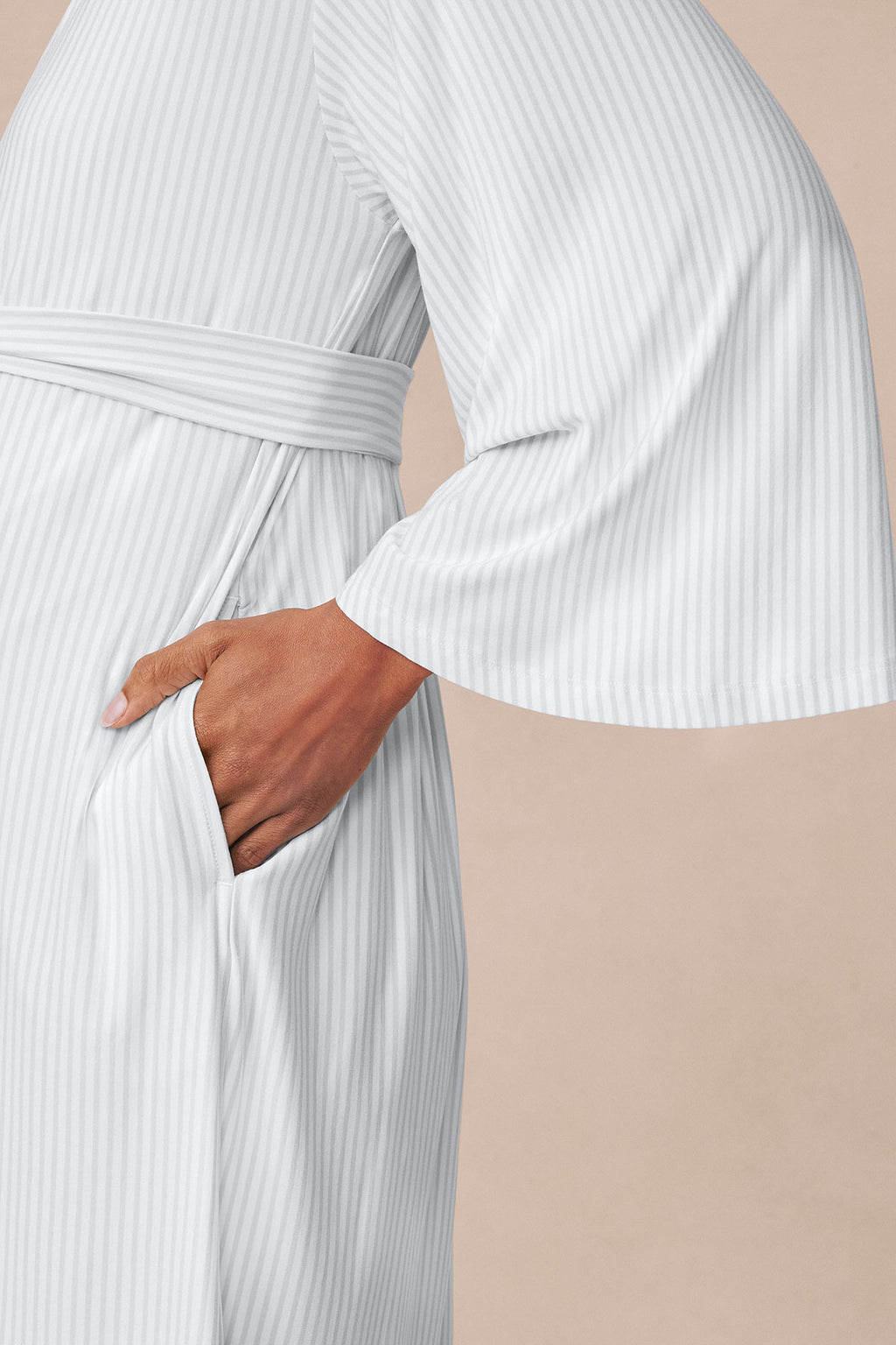 Light gray ribbed kimono nightgown with tie waist and bell sleeves, worn open to show front pocket detail.