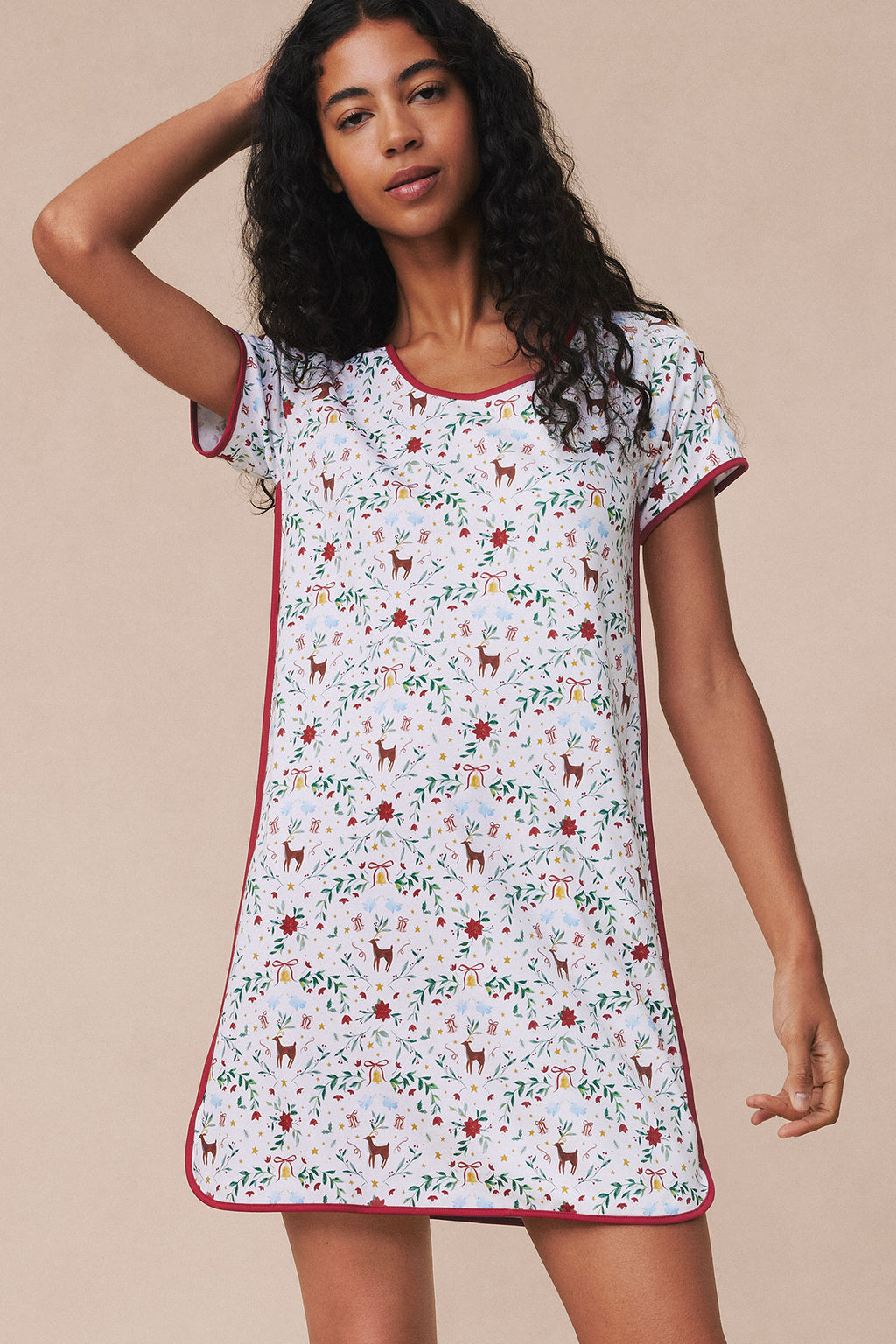 Light blue nightgown with red trim featuring small holiday-themed print including reindeer, bells, and greenery.