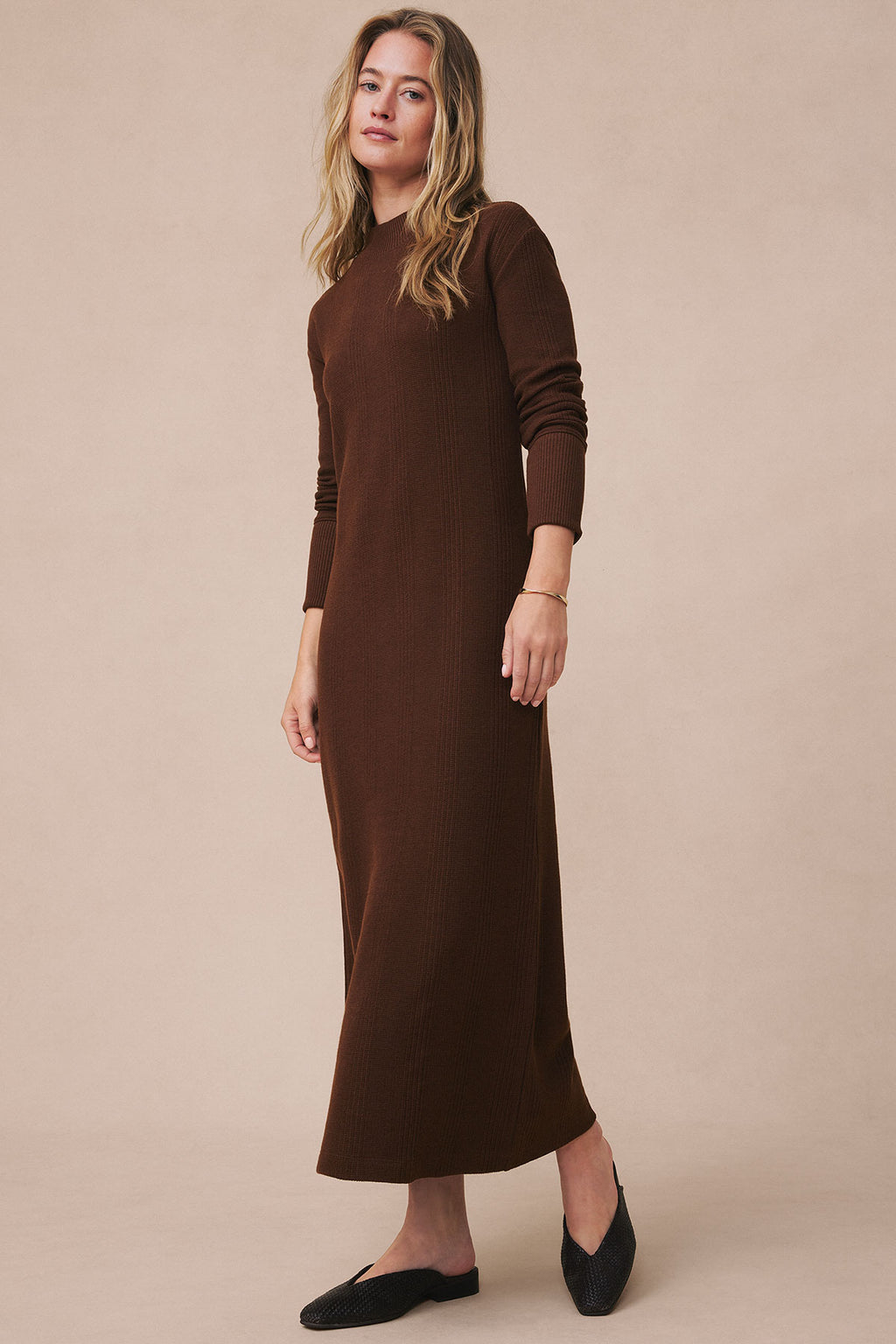 Brown waffle knit midi dress with long sleeves and crew neckline on model.