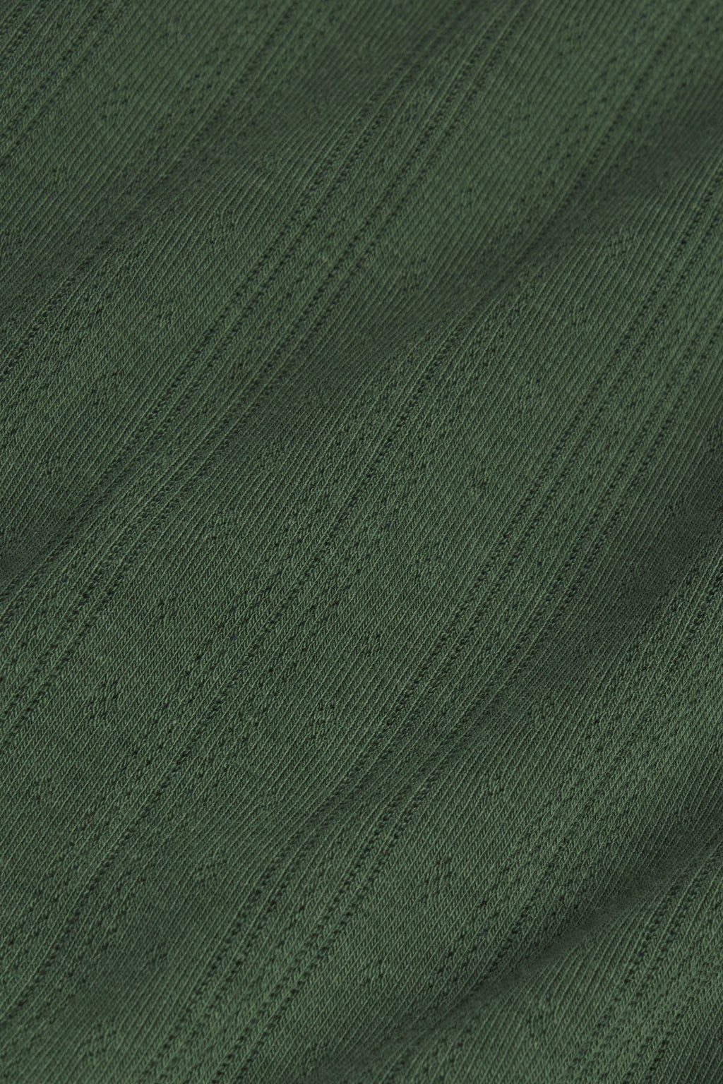 Rosemary green pointelle-knit fabric with vertical ribbed texture and small eyelet details throughout.