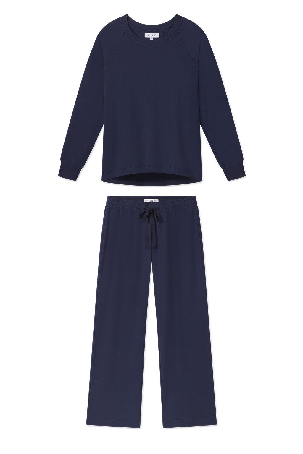 The Relax Pants Set in English Navy includes a matching long-sleeve crewneck top and wide-leg drawstring pants, shown flat on a white background, combining comfort with effortless style.