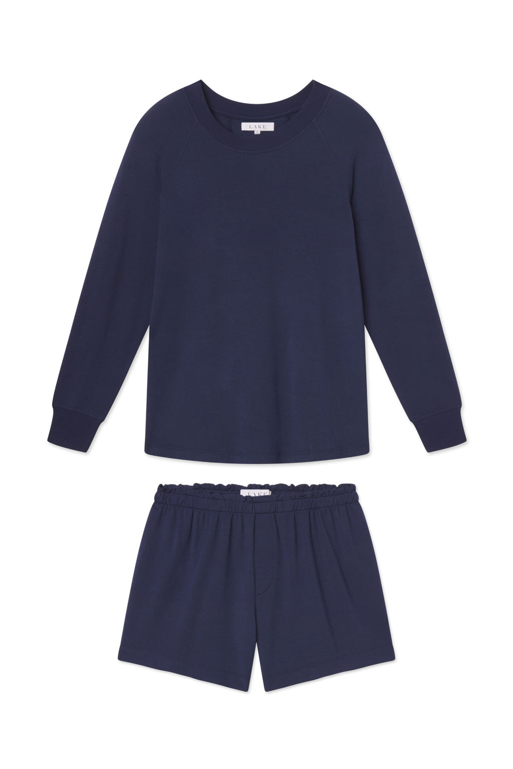 The Relax Shorts Set in English Navy features a long-sleeve top with ribbed cuffs and elastic-waist modal shorts, both displayed flat on a white background.