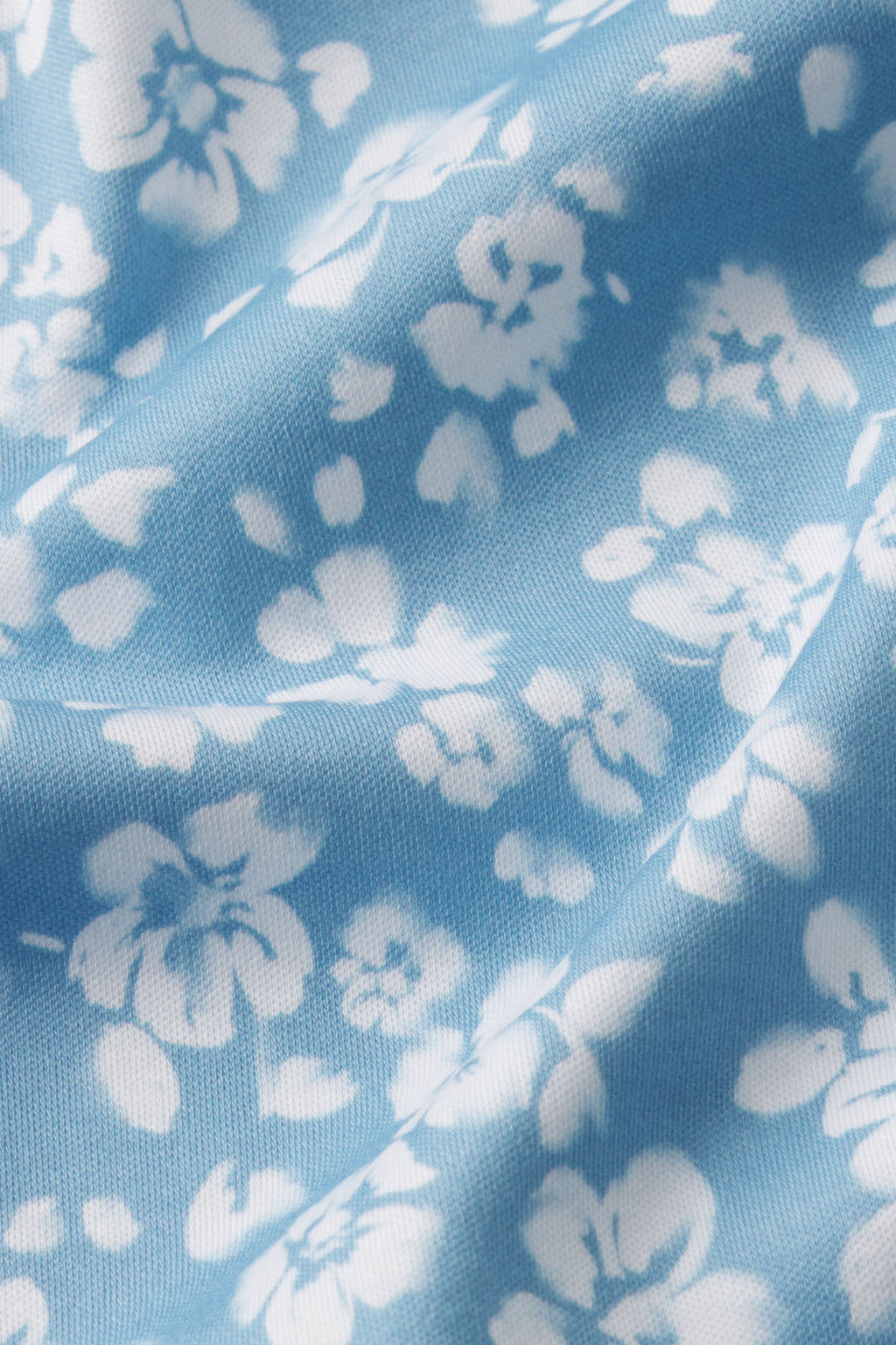 Close-up of the Pima Maternity Nightgown in Serene Blue Anemones, showing soft light blue Pima cotton with white anemone flower silhouettes—ideal for comfort and elegant style during maternity.