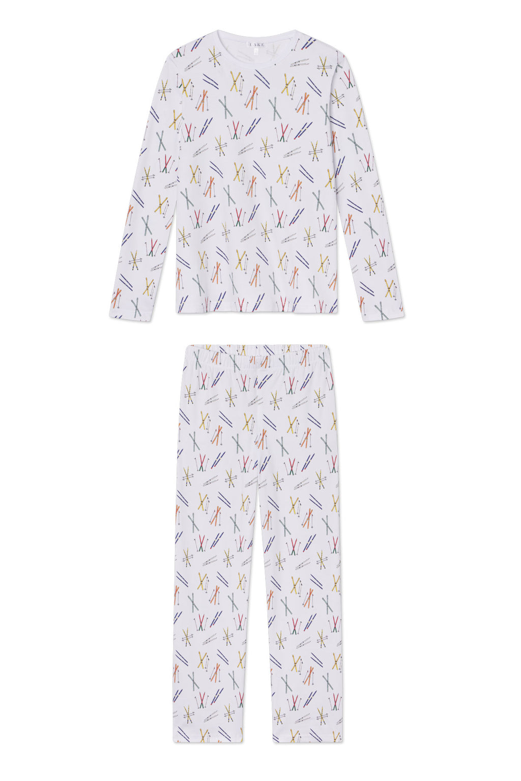 The Pima Crew Long-Long Set in Vintage Skis features a white children’s pajama set with long sleeves and pants, decorated with colorful vintage skis and skiers print in red, yellow, blue, and pink on a white background.