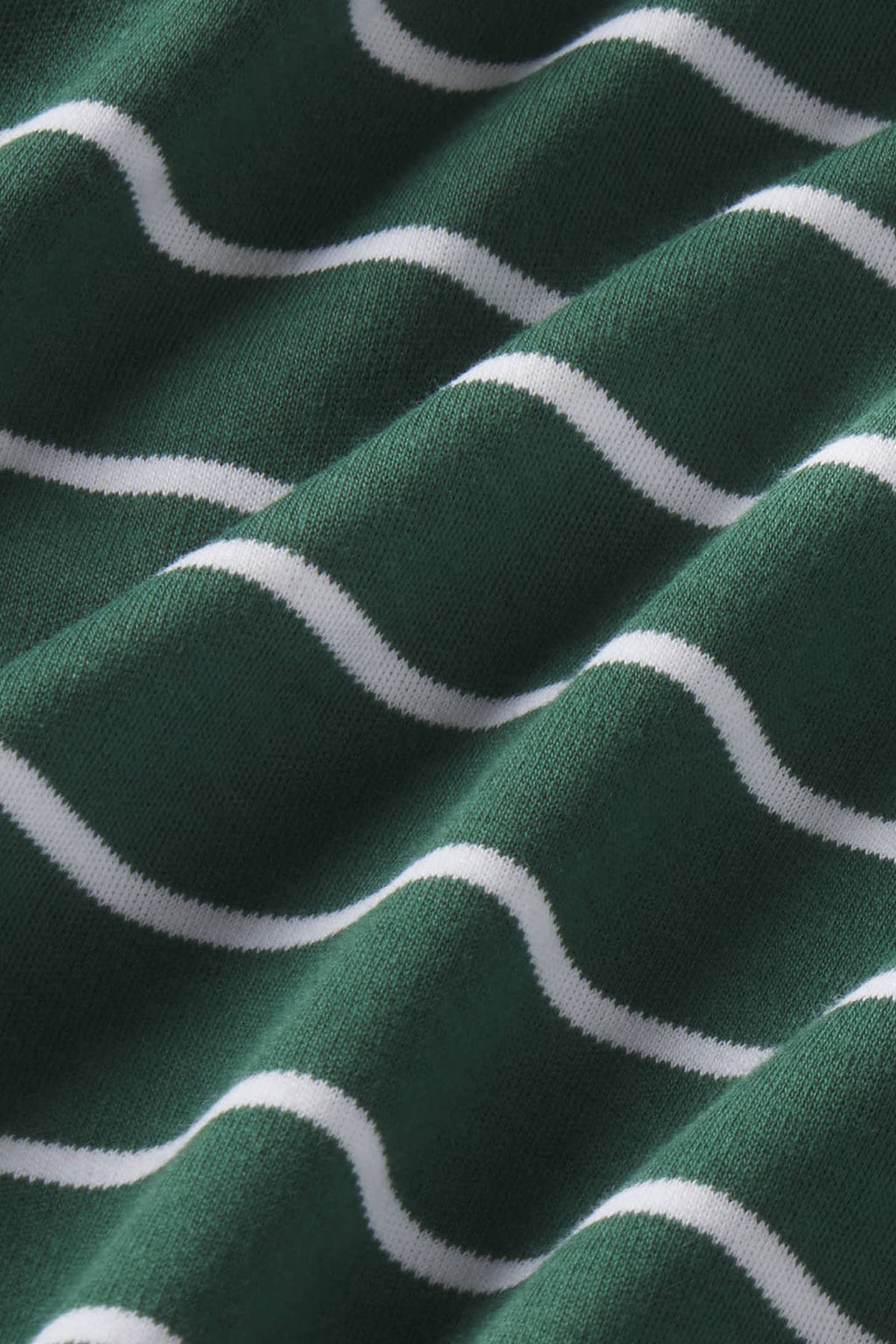 Trekking green knit fabric with white wavy stripe pattern.