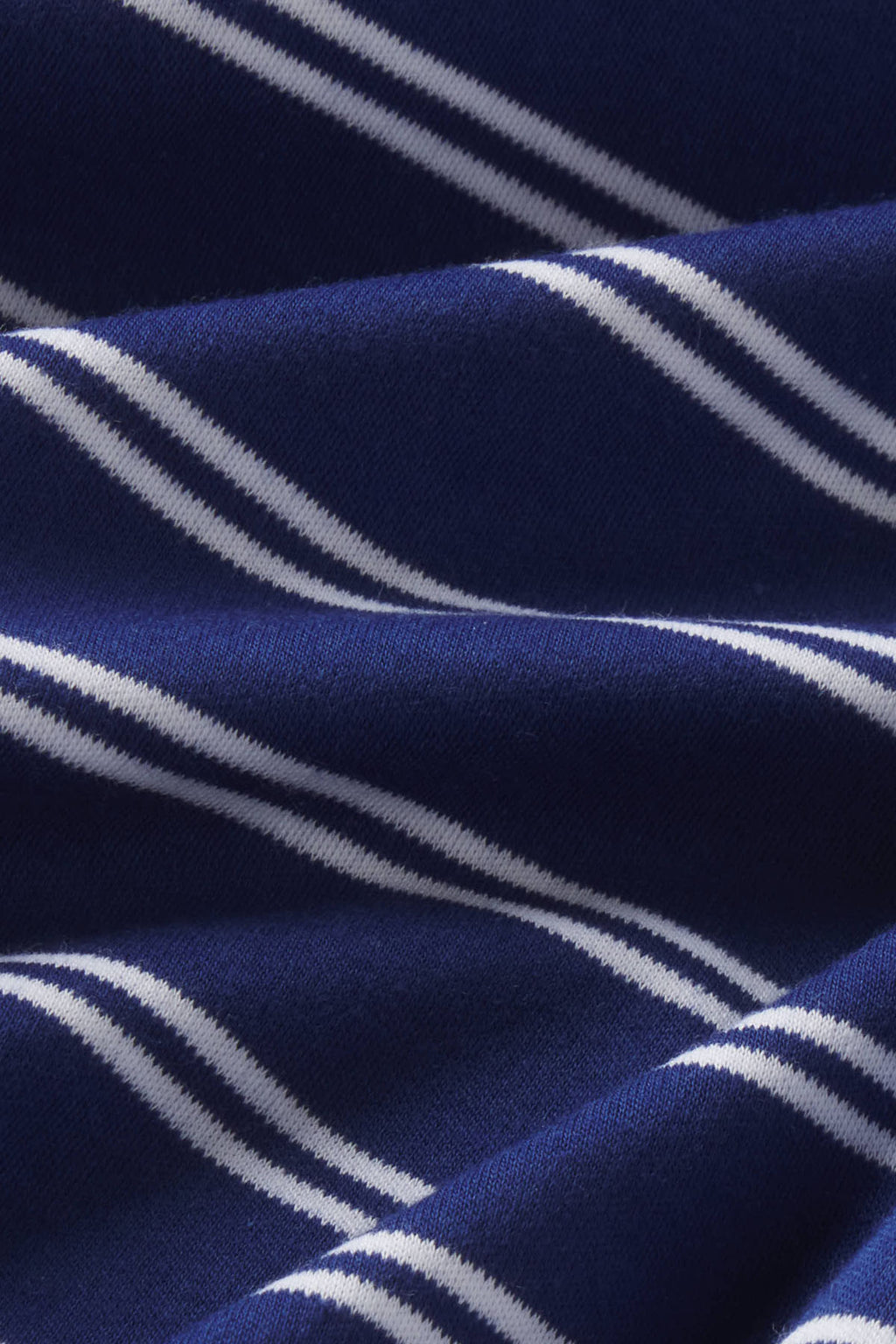 Navy and blue striped Pima cotton fabric with white diagonal stripes in close-up detail.