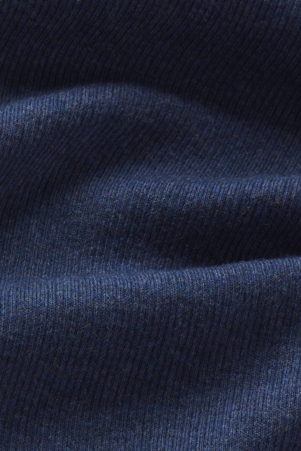 Navy heather ribbed fabric with vertical texture and folds showing the material construction.