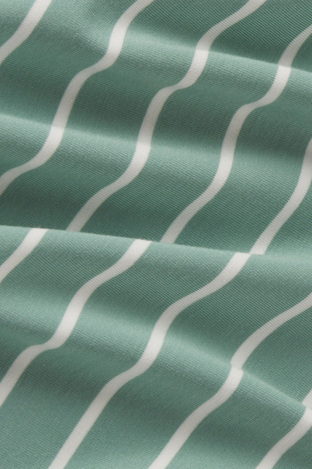 Boxwood green fabric with white vertical wavy stripes in a textured weave.
