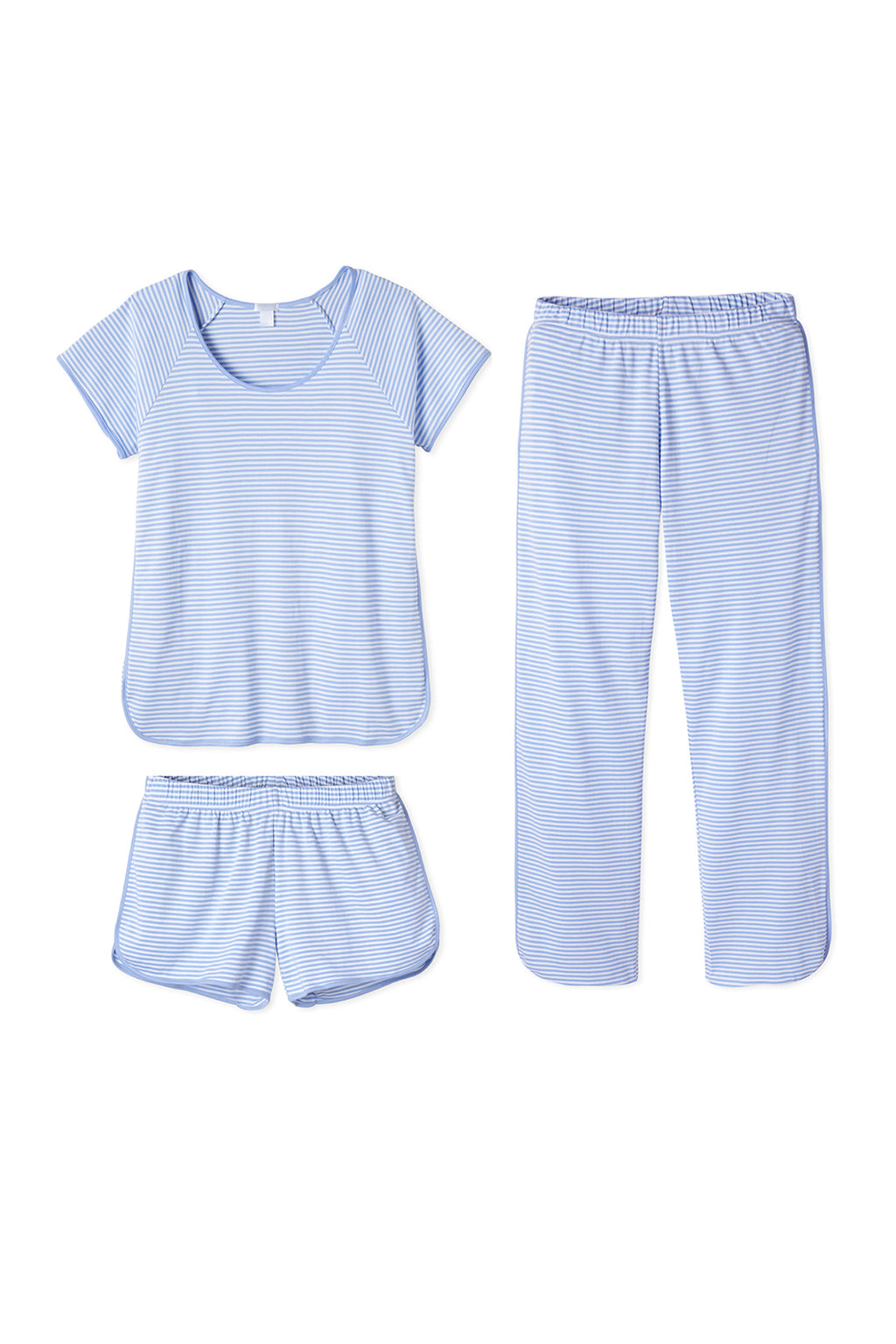 The Pima Bundle in Hydrangea features a light blue pajama set with thin white stripes, made from soft Pima cotton. It includes a round-neck top and an elastic waistband on both matching shorts and long pants, all displayed on a white background.